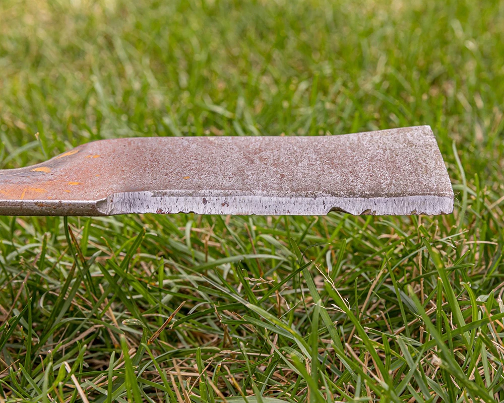mower blade damaged after cutting wet grass